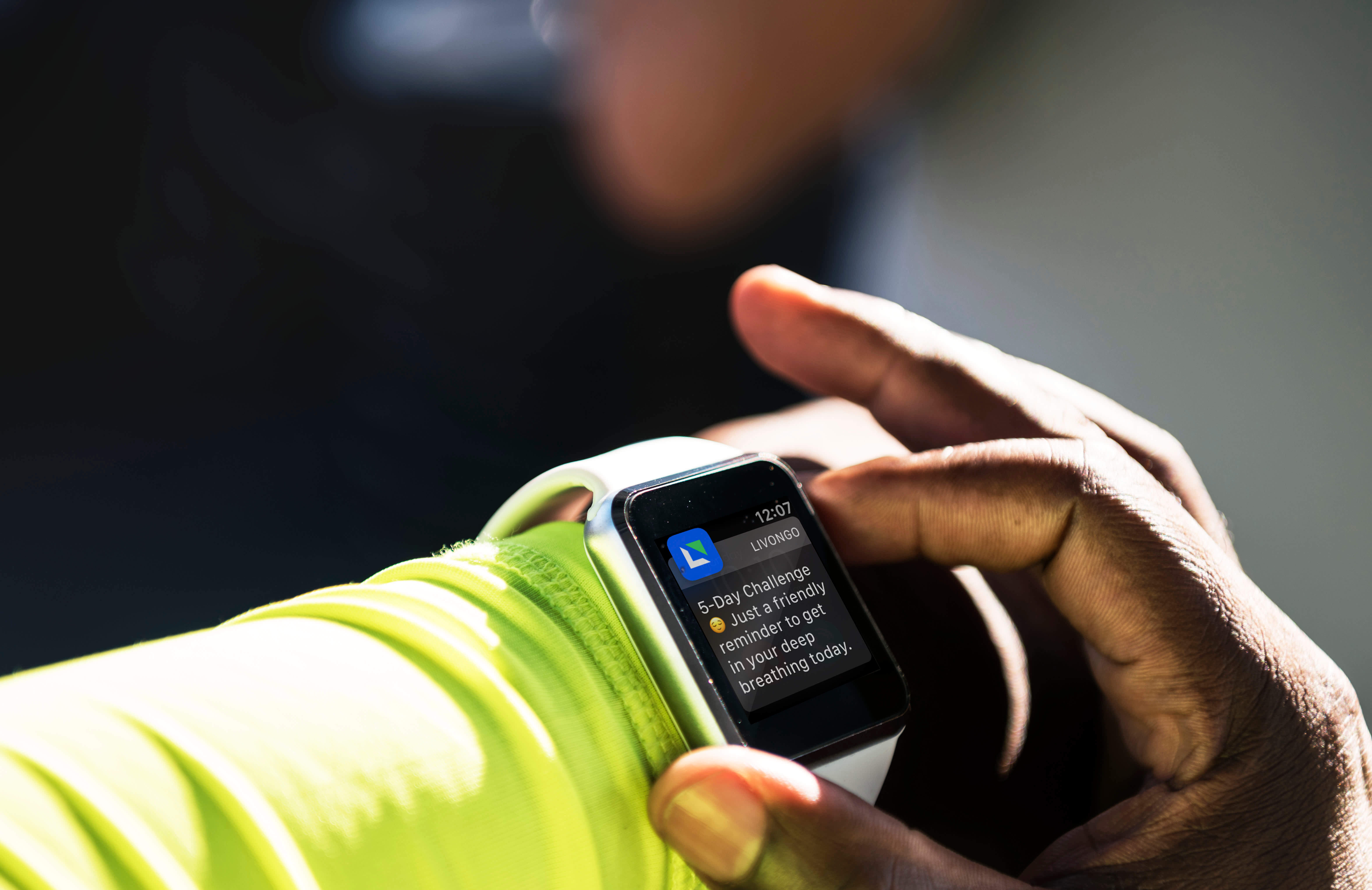 Smartwatch showing a Livongo notification reminding the wearer to do deep breathing